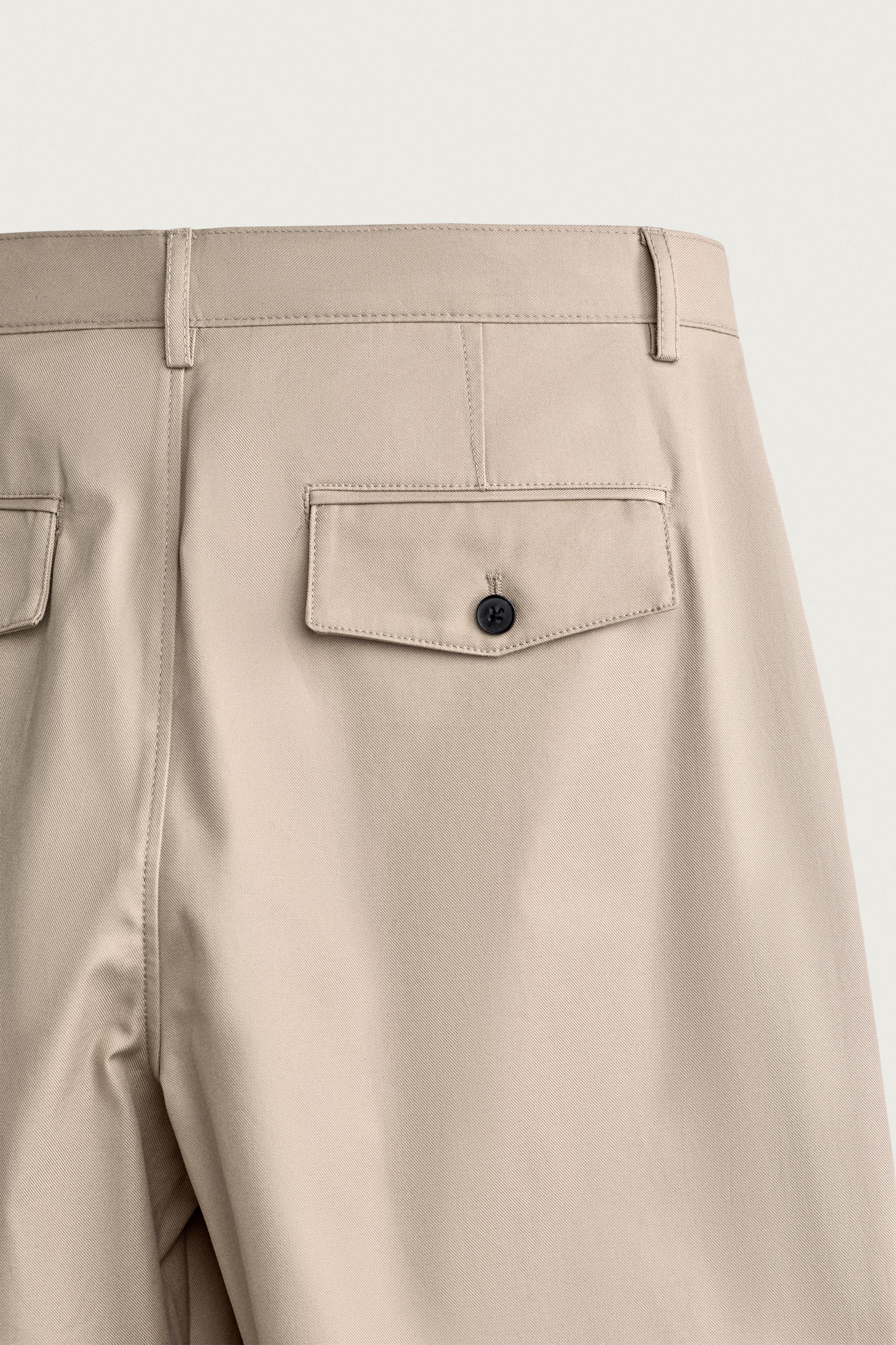 STRAIGHT FIT PLEATED PANTS